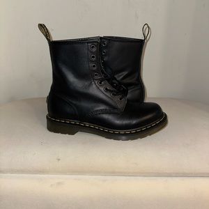 Matte black Dr Marten boots.